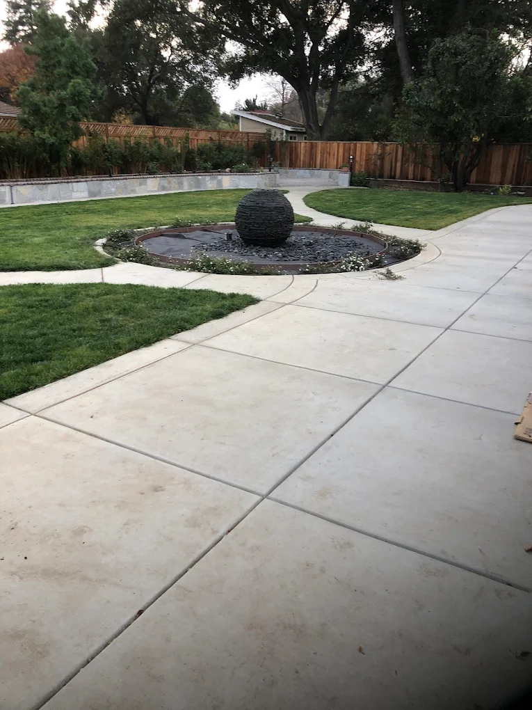 Decorative concrete circle around a garden fountain